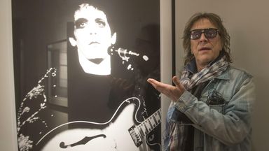 British photographer Mick Rock stands by his photo of American rock musician Lou Reed during the opening of the photo exhibition 'Mick Rock - the man who shot the 70's' at the Pelle Unger gallery in Stockholm, Sweden, on April 11, 2013. - Image ID: 2GJ7TE5 (RM)  
